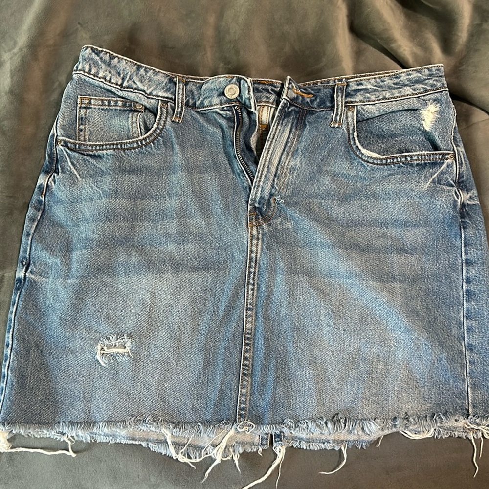 Denim skirt size 12. Small tear by zipper but covered by inside denim.